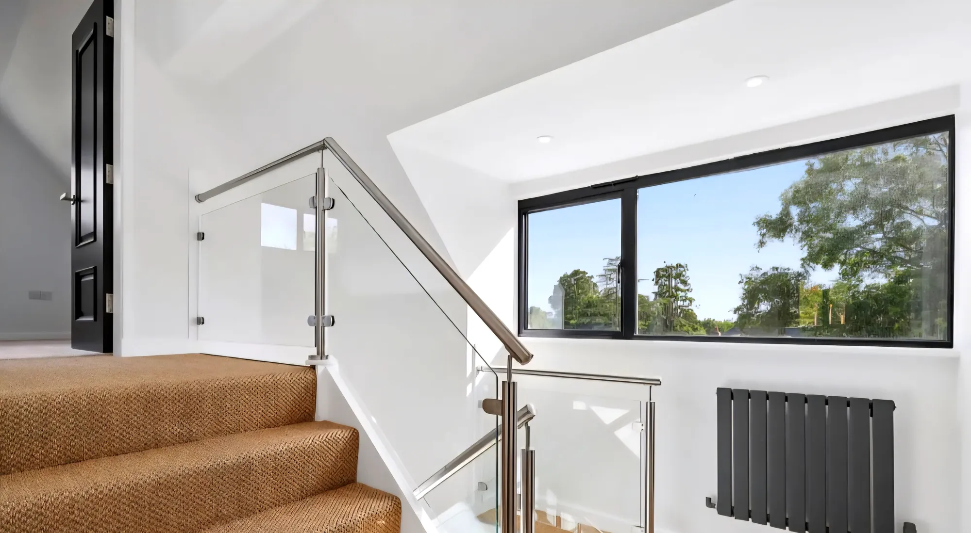 Staircase with a glass balustrade