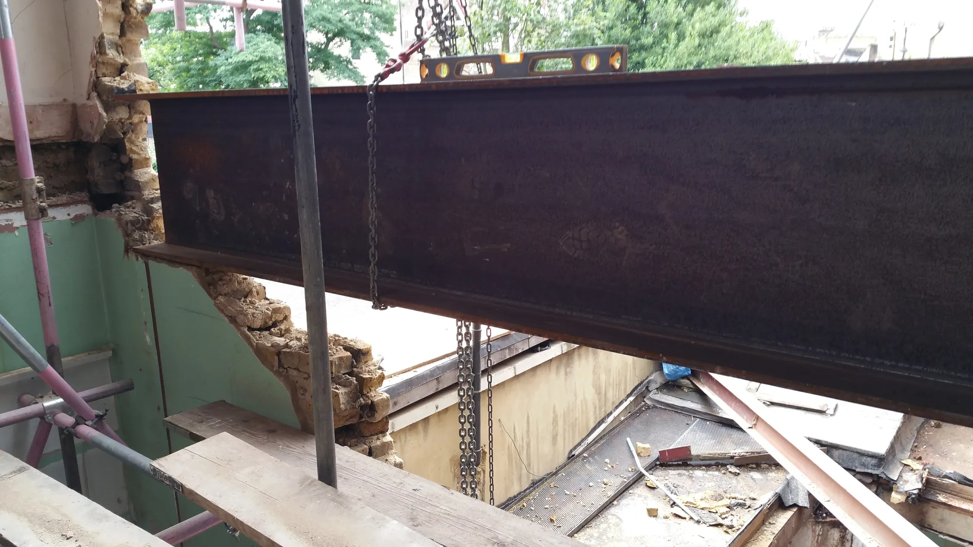 Lifting a new steel beam into place