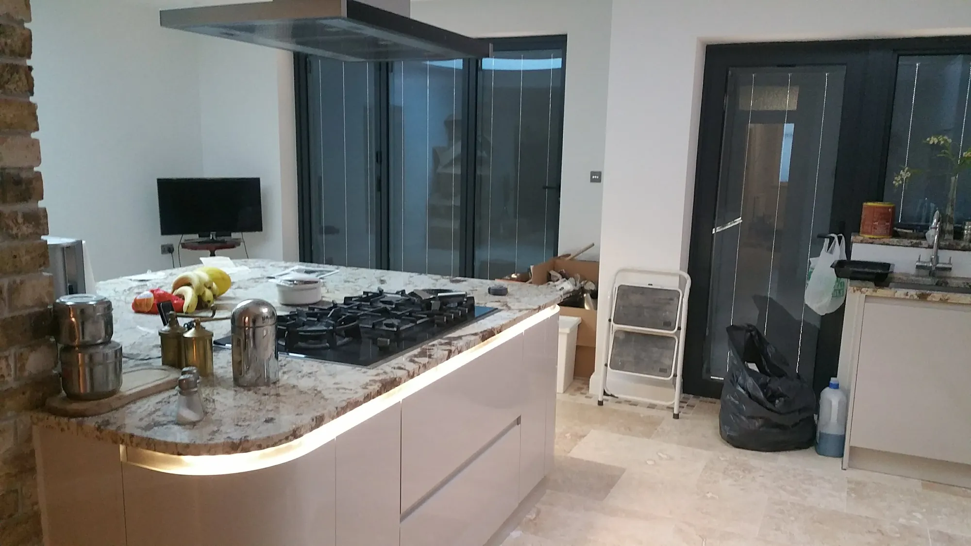 Kitchen with a curved island in the new extension