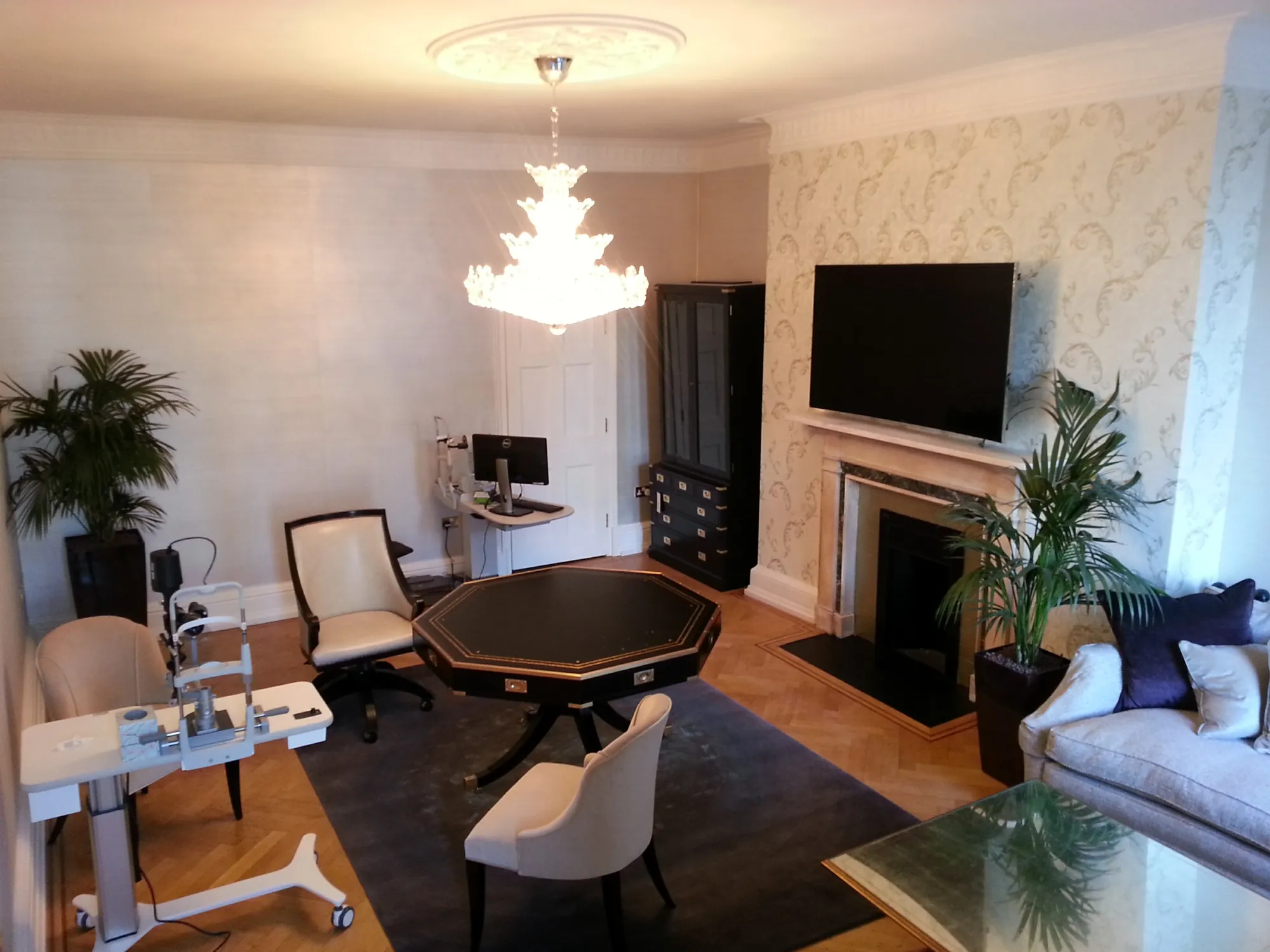 Restored room with the chandelier and fireplace