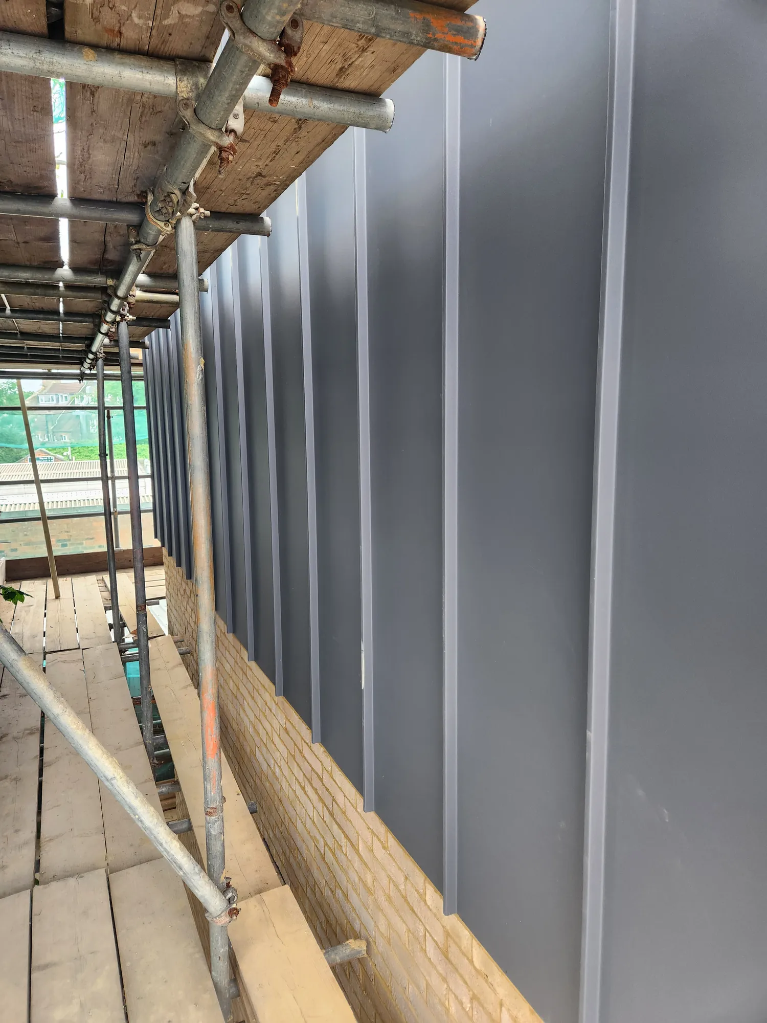 Standing seam cladding going on