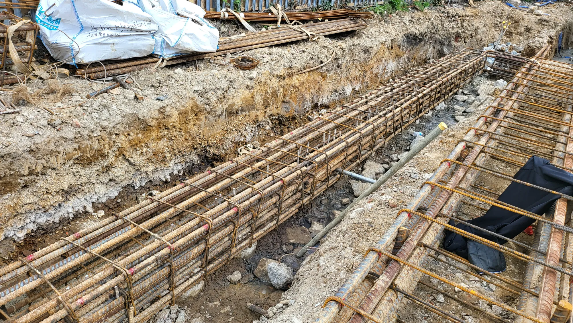 Reinforcement cages laid in the foundation trench