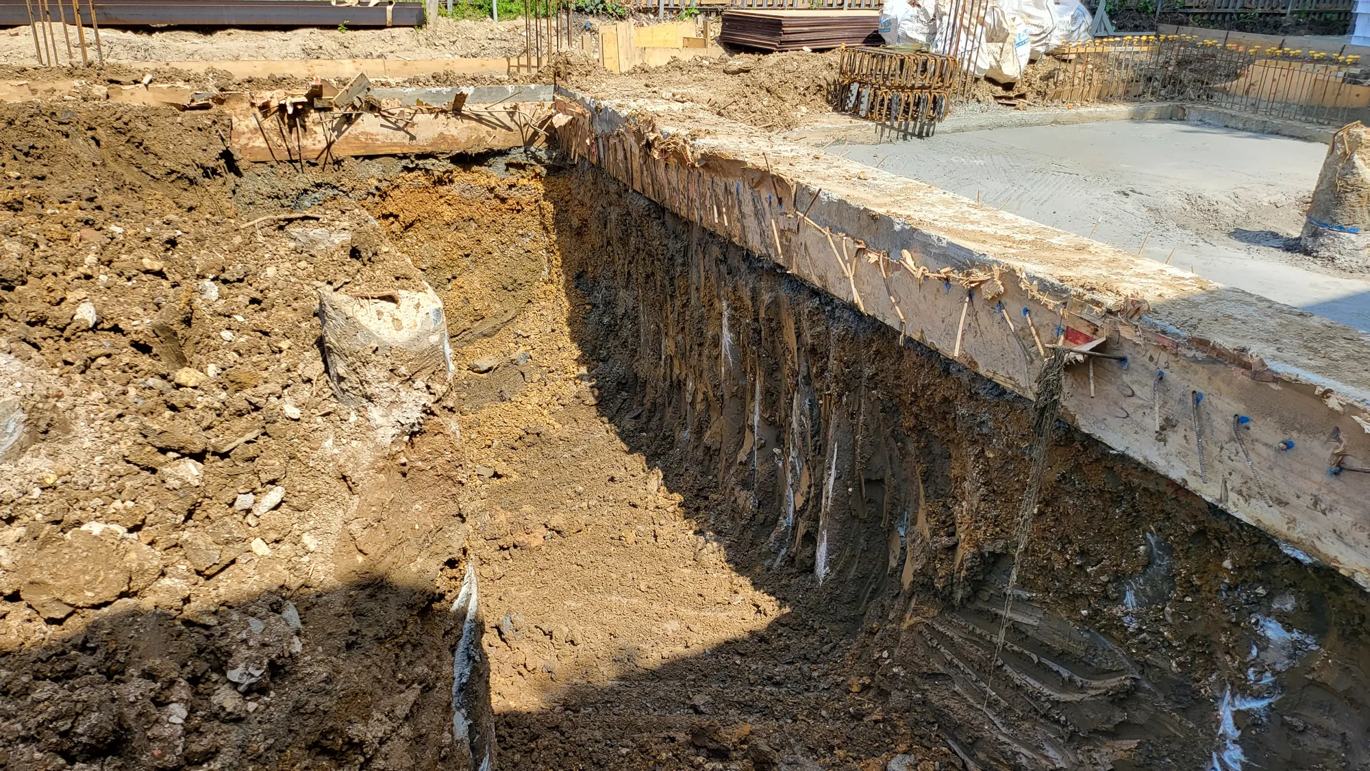 Digging down inside the piled wall