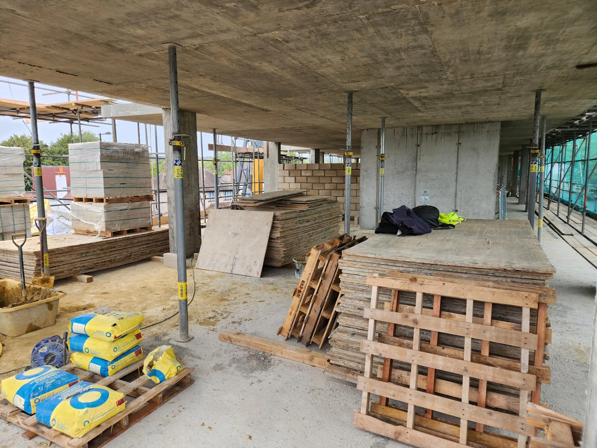 Inside the frame, with blocks stacked ready for the walls