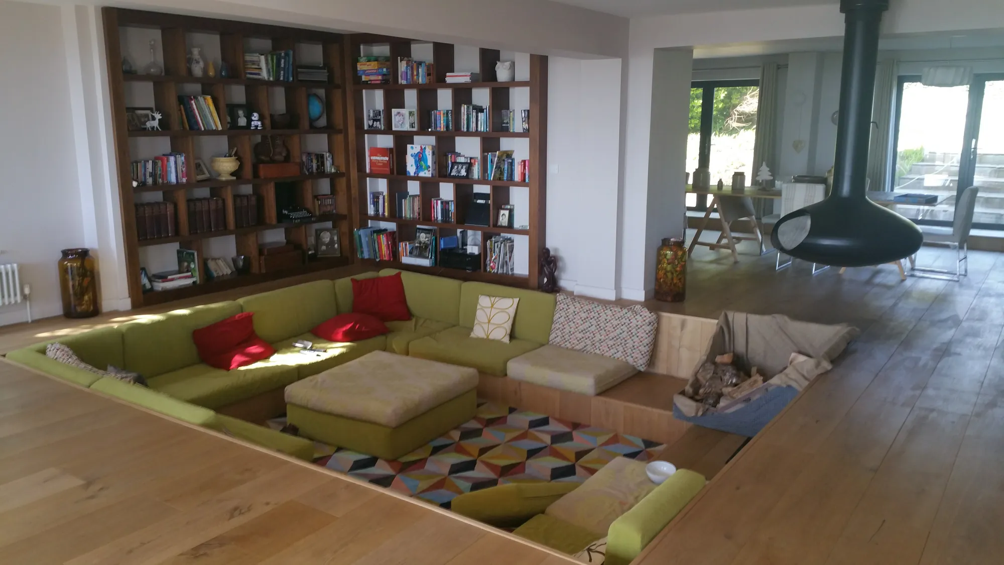 Sunken lounge with a full-height bookcase