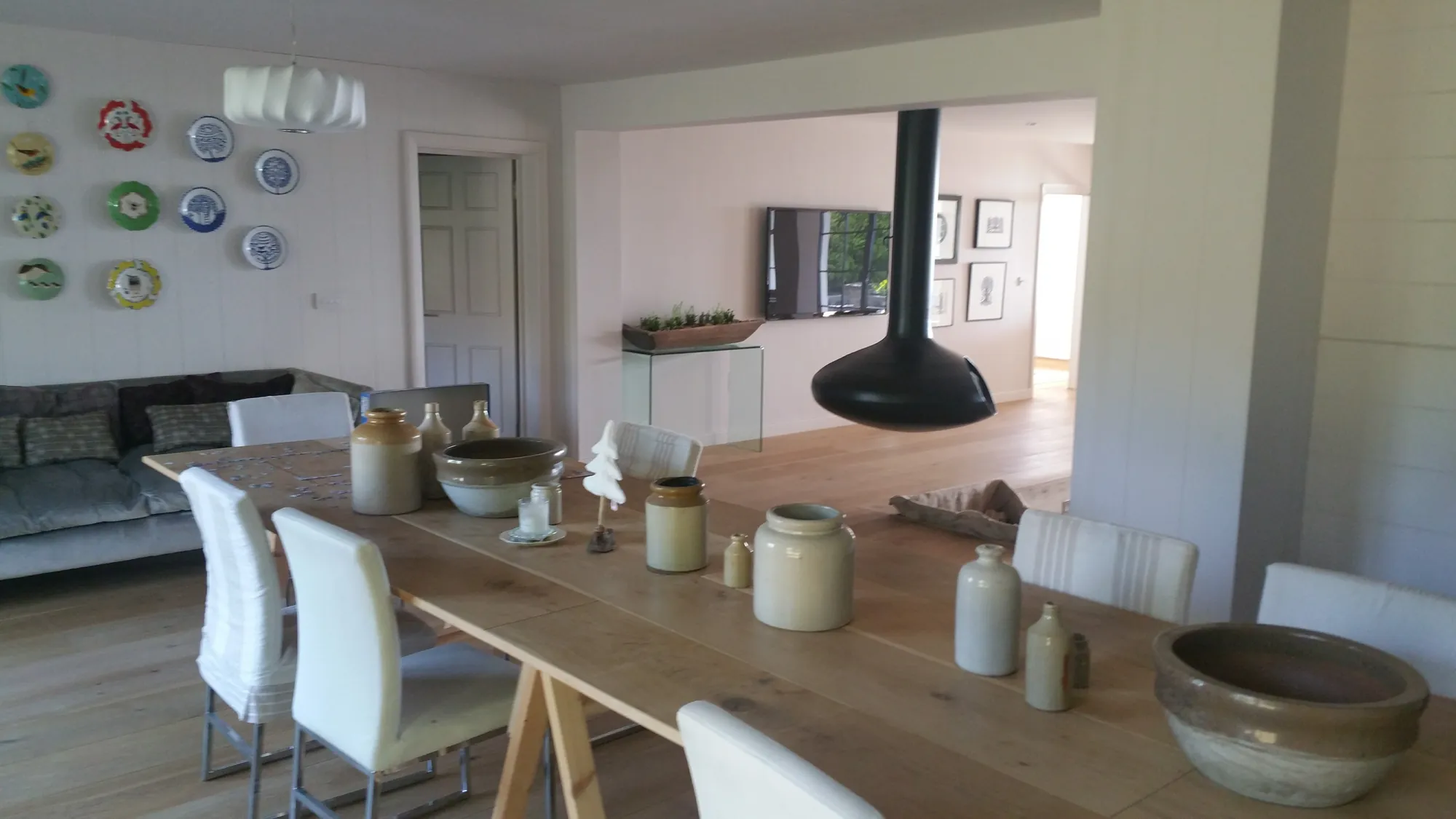 Dining space with a suspended fireplace