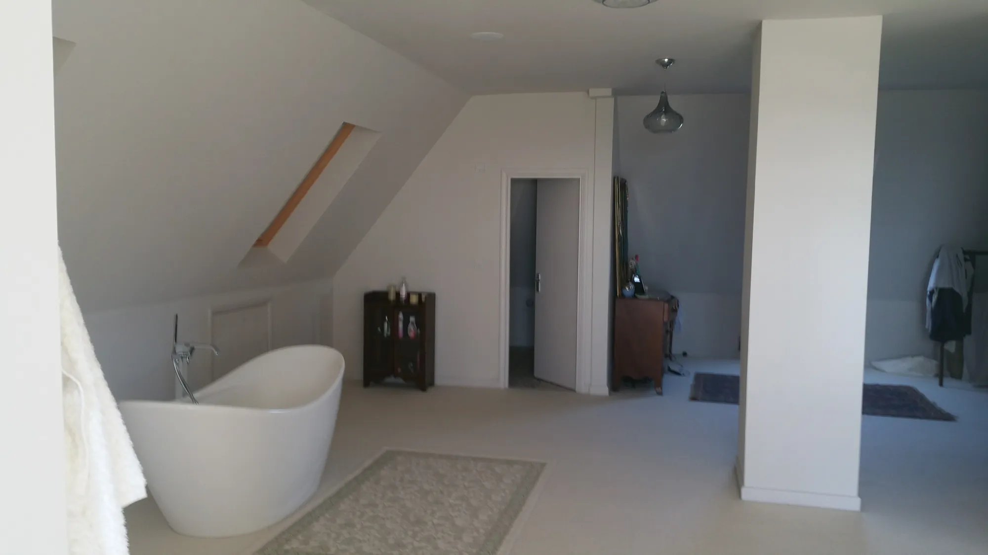 Loft bathroom with a freestanding bath
