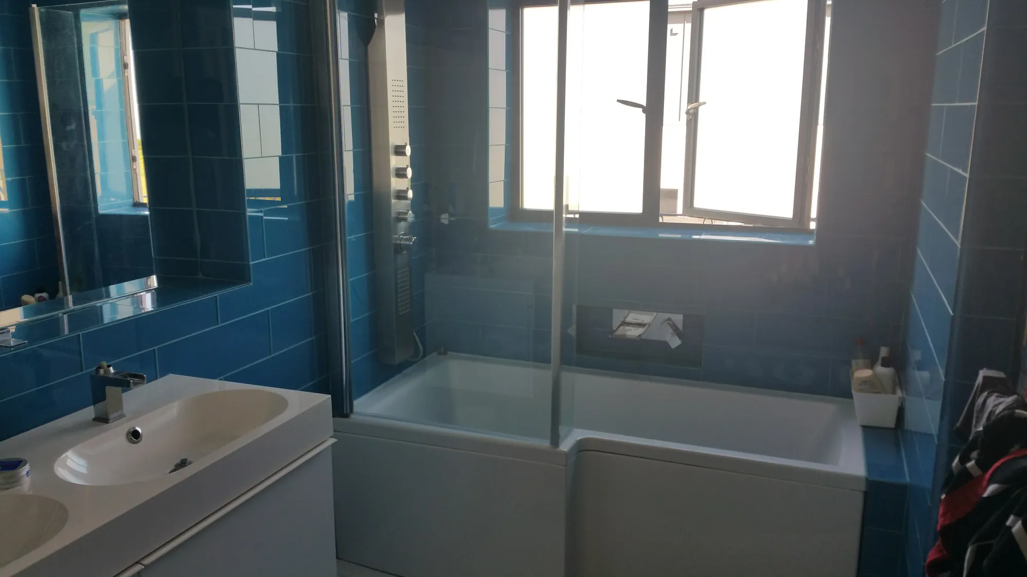 Bathroom with blue tiling