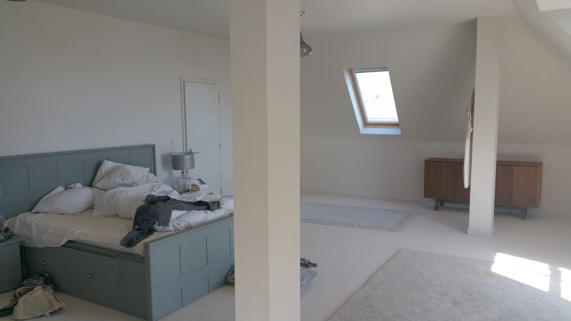 Loft bedroom under the roof windows