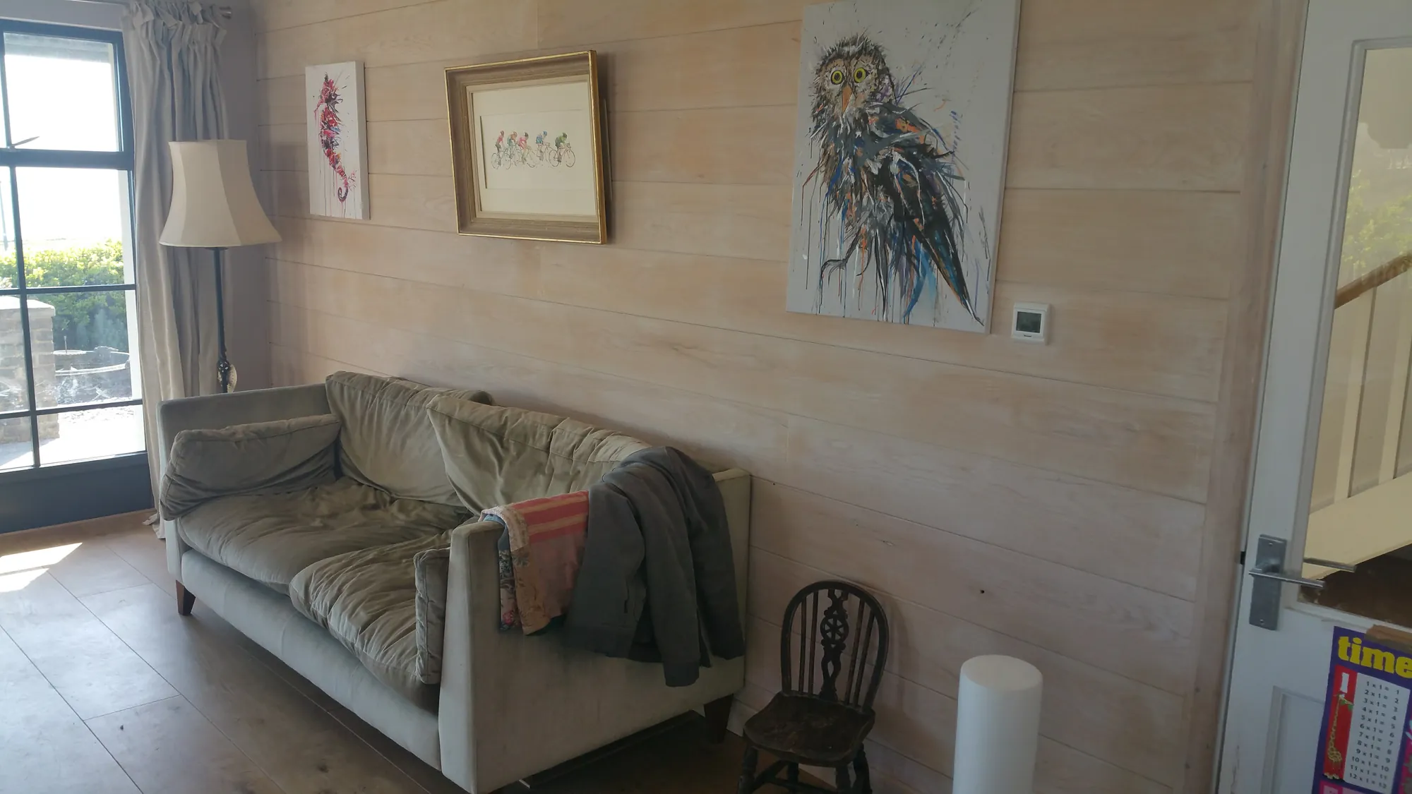 Lounge with whitewashed timber panelling