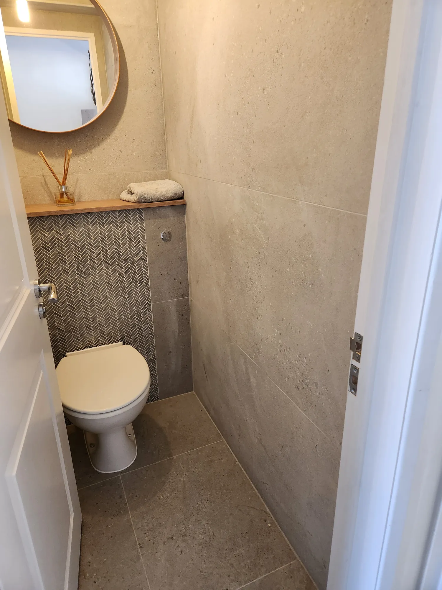 Cloakroom with herringbone tiling