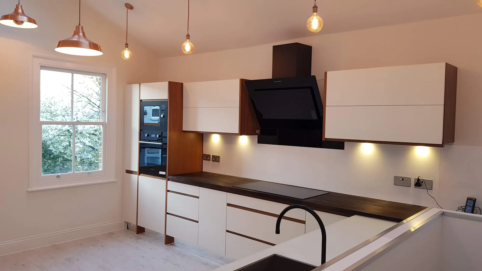 Kitchen with copper pendants