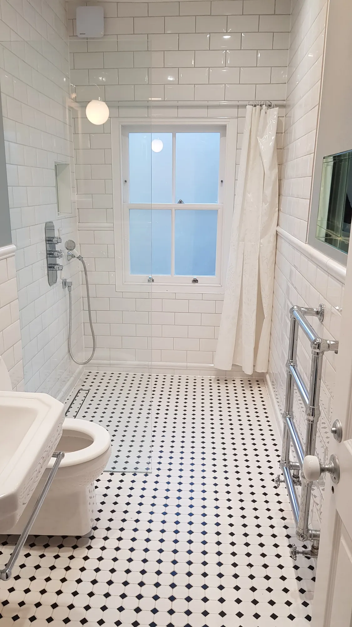 Shower and heated towel rail