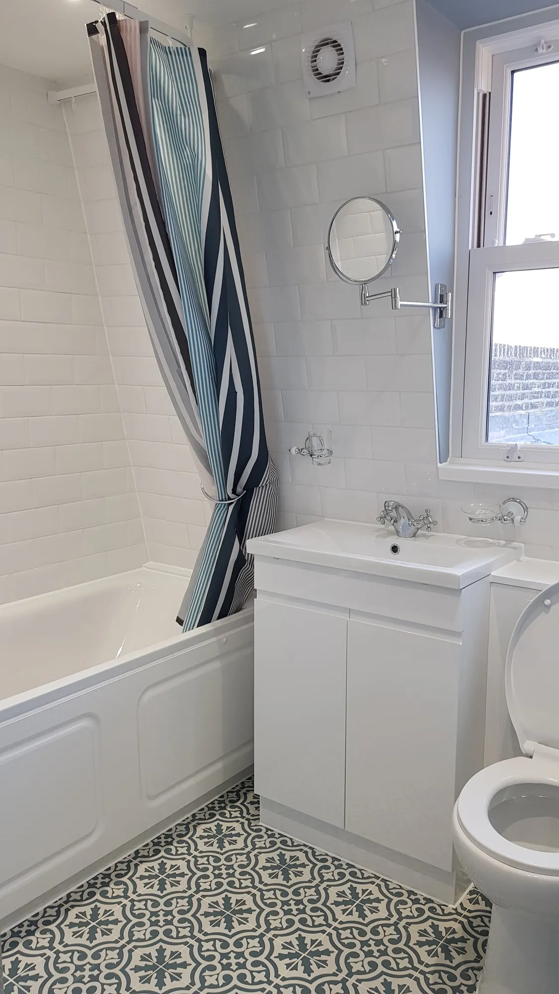 Upstairs bathroom with old English pattern floor tiles