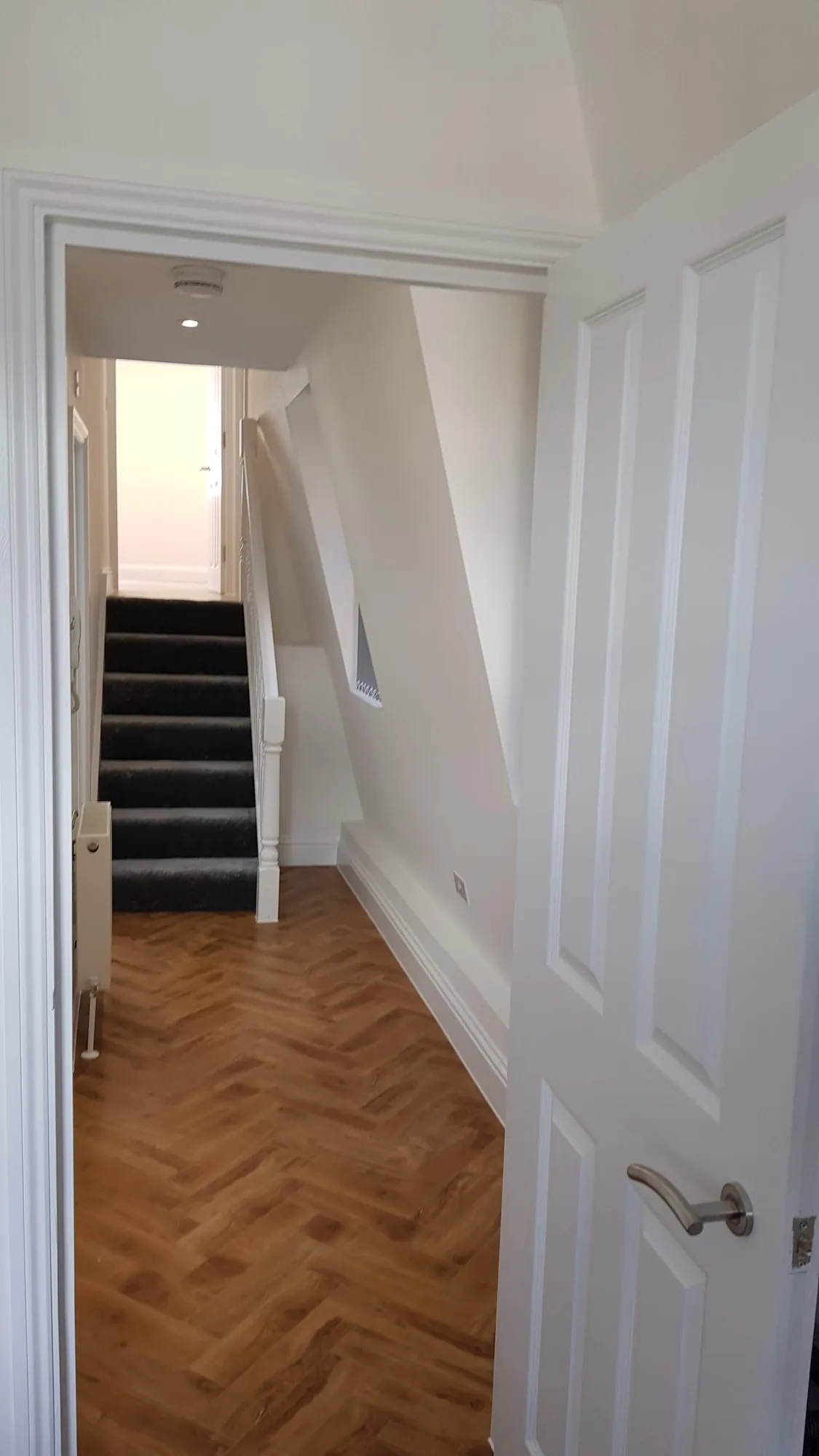 Hallway with herringbone flooring